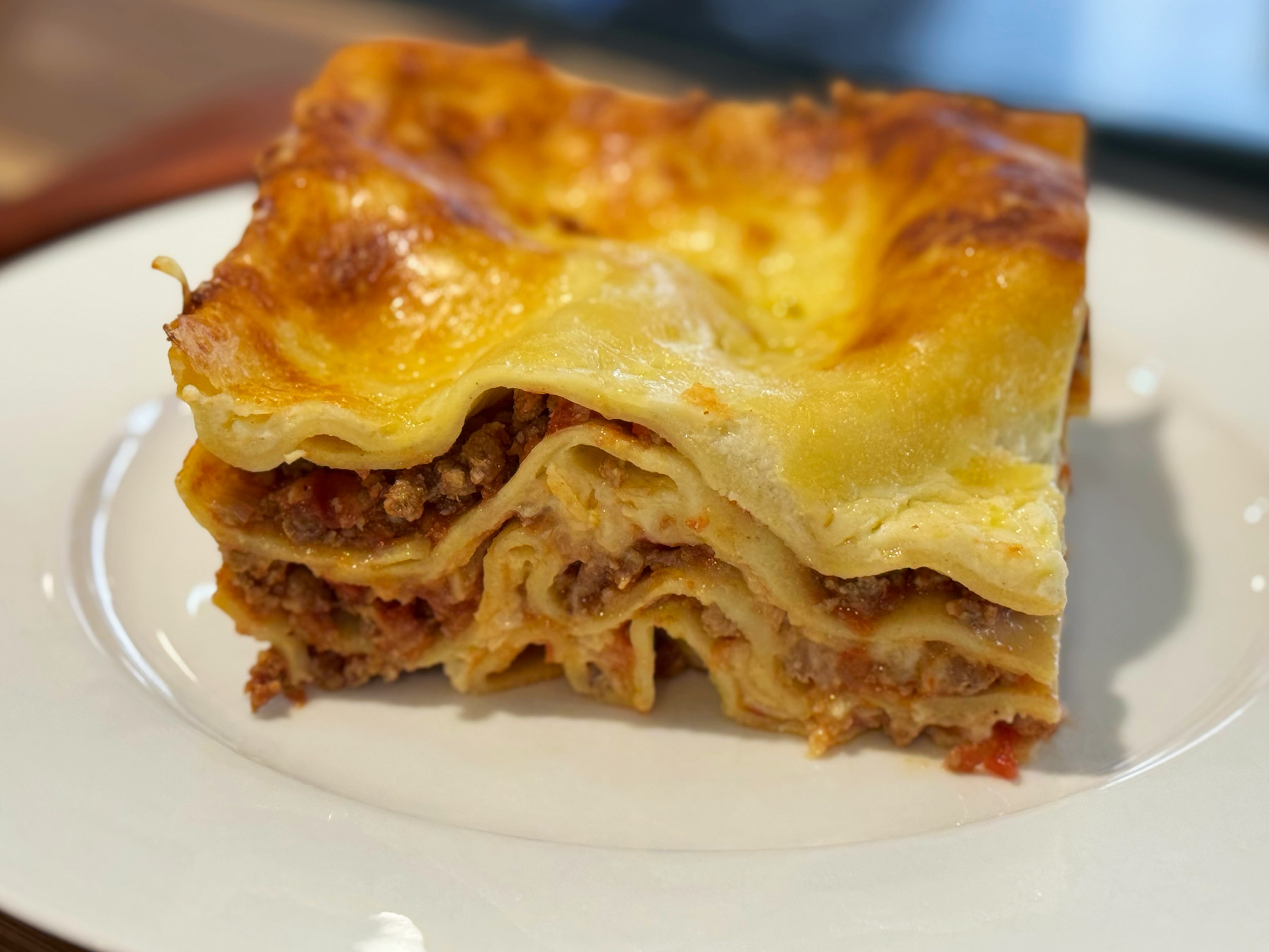 Hearty family lasagna with rich meat ragù, béchamel, and melted cheese.