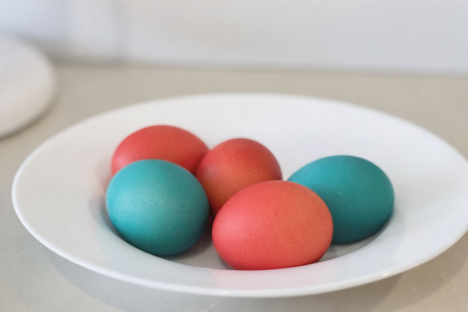 Naturally dyed eggs in soft pastel colors, perfect for Easter baking.