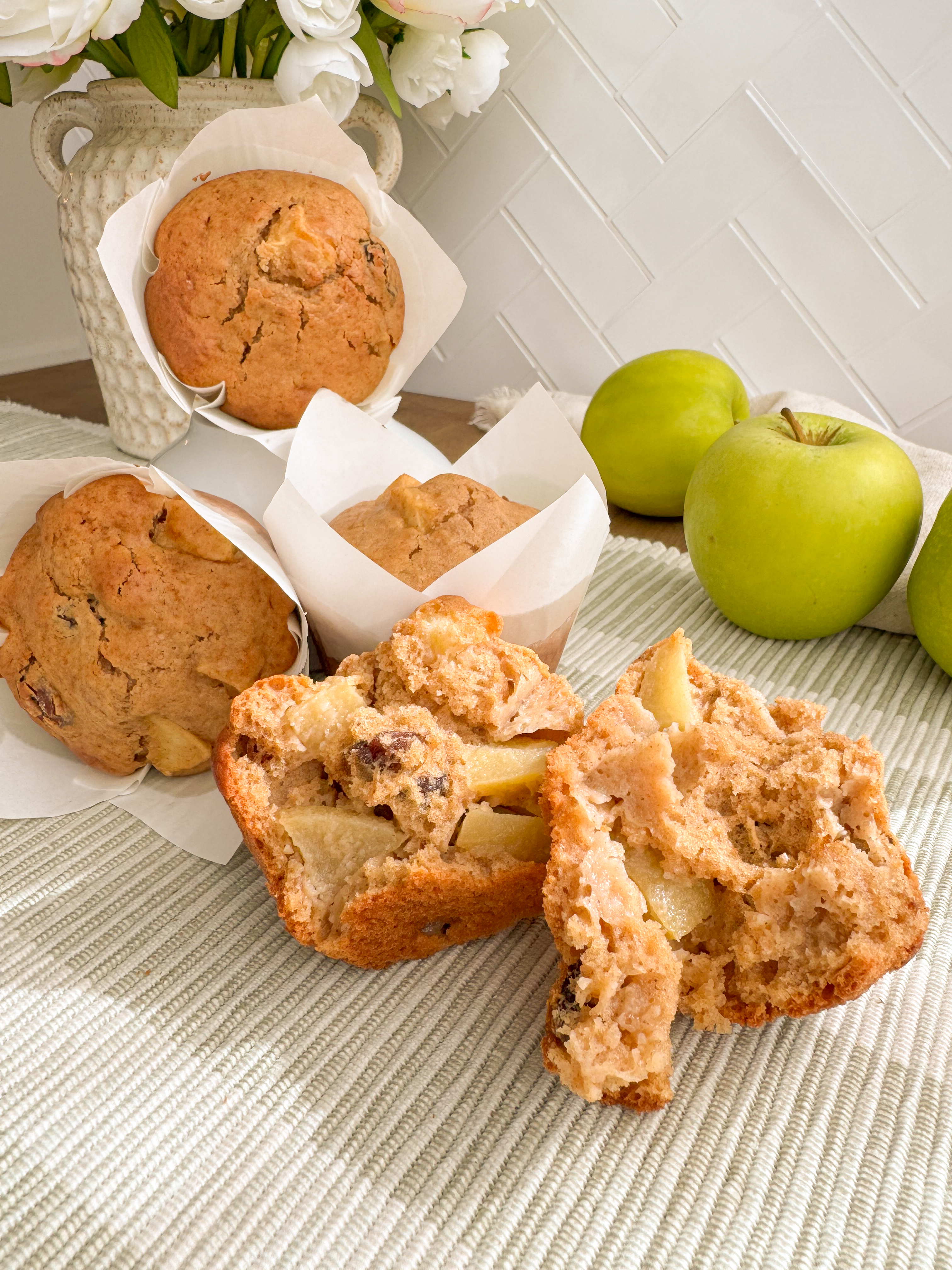 Brown sugar apple cinnamon muffins with golden domed tops.