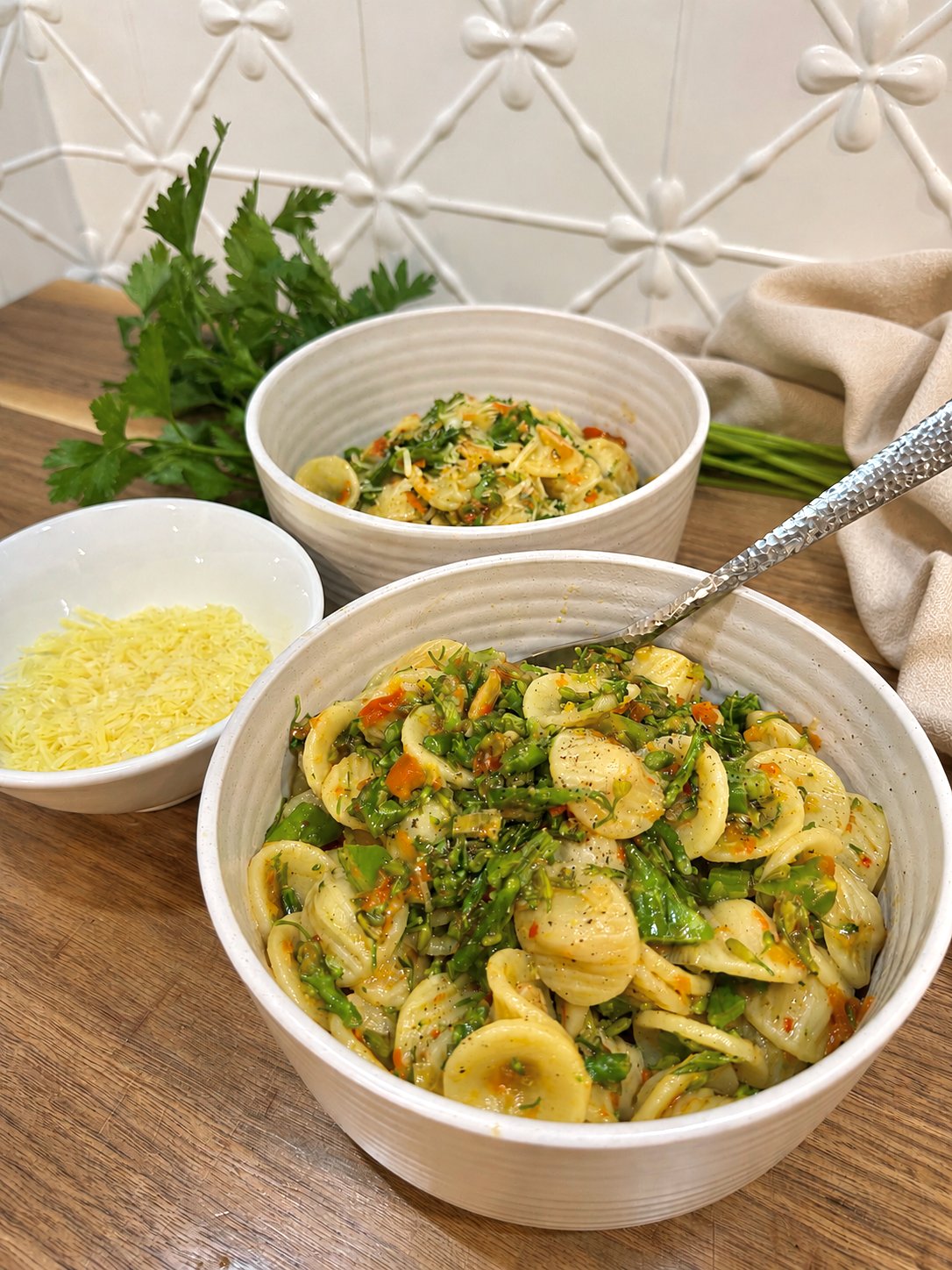 Orecchiette pasta with broccolini, spring onion and red pimenta moída, finished with Parmesan.