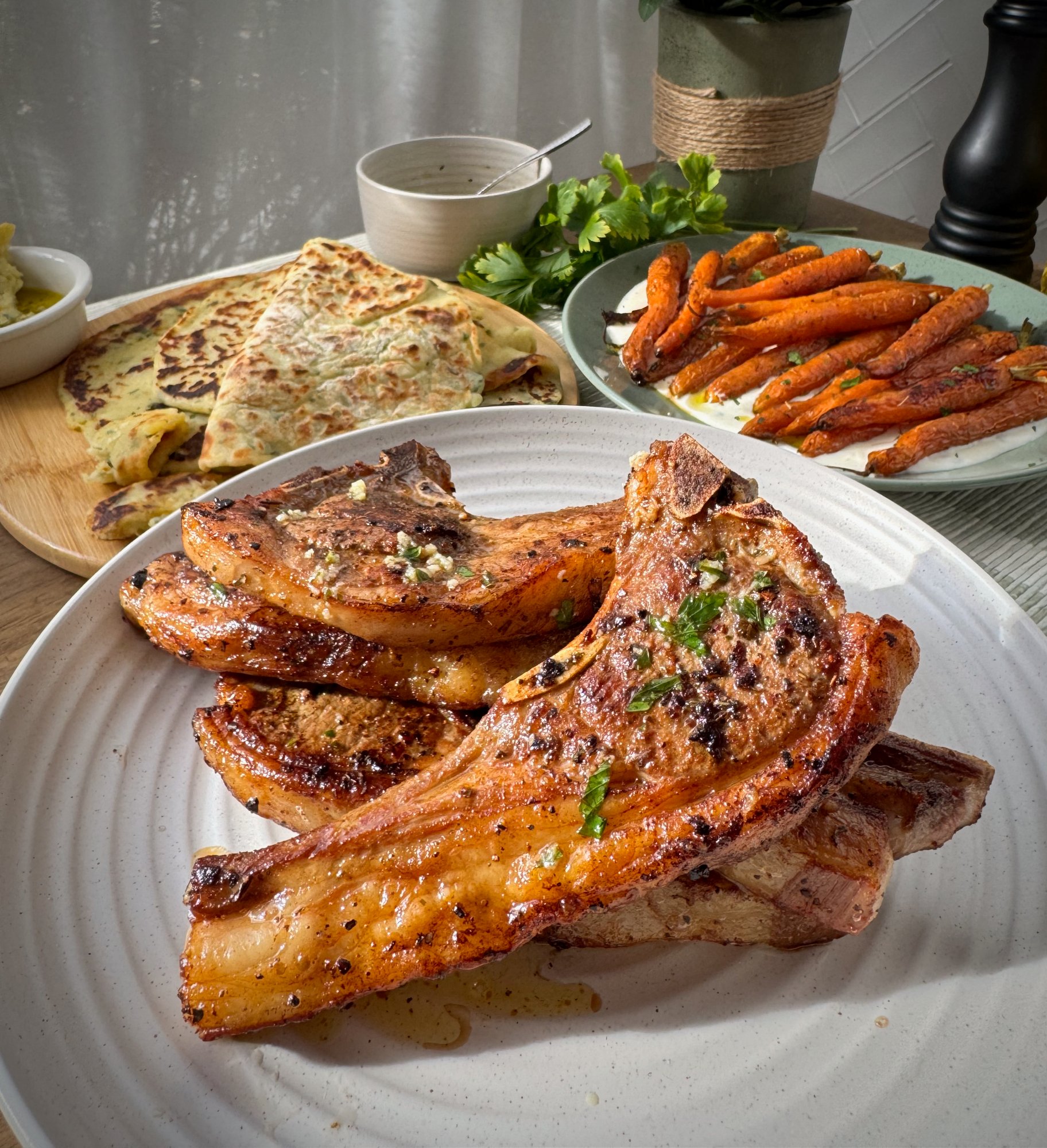 Golden pan-seared Greek-style lamb loin chops with lemon and oregano.