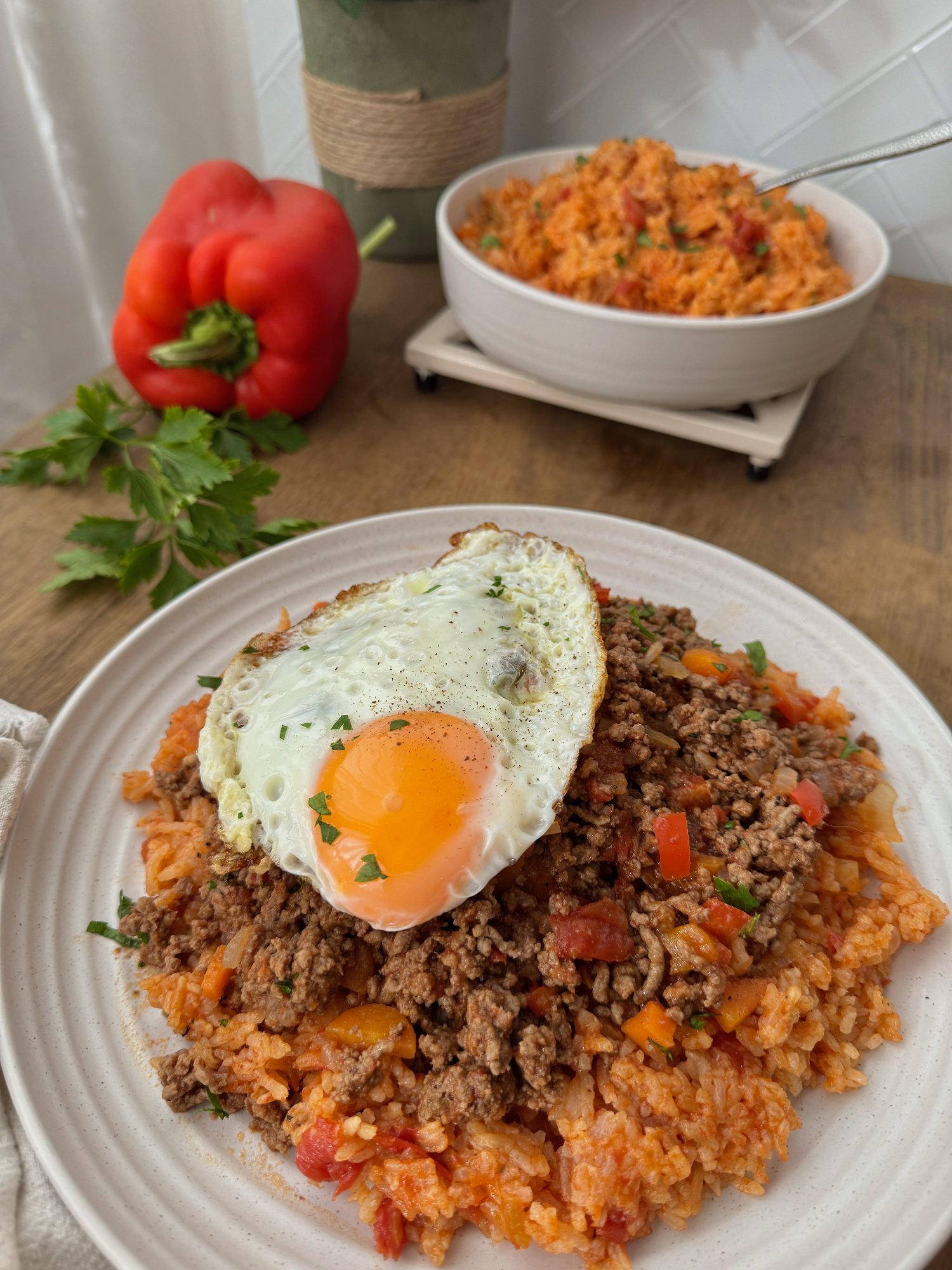 Portuguese-style beef mince over tomato rice, topped with a fried egg.