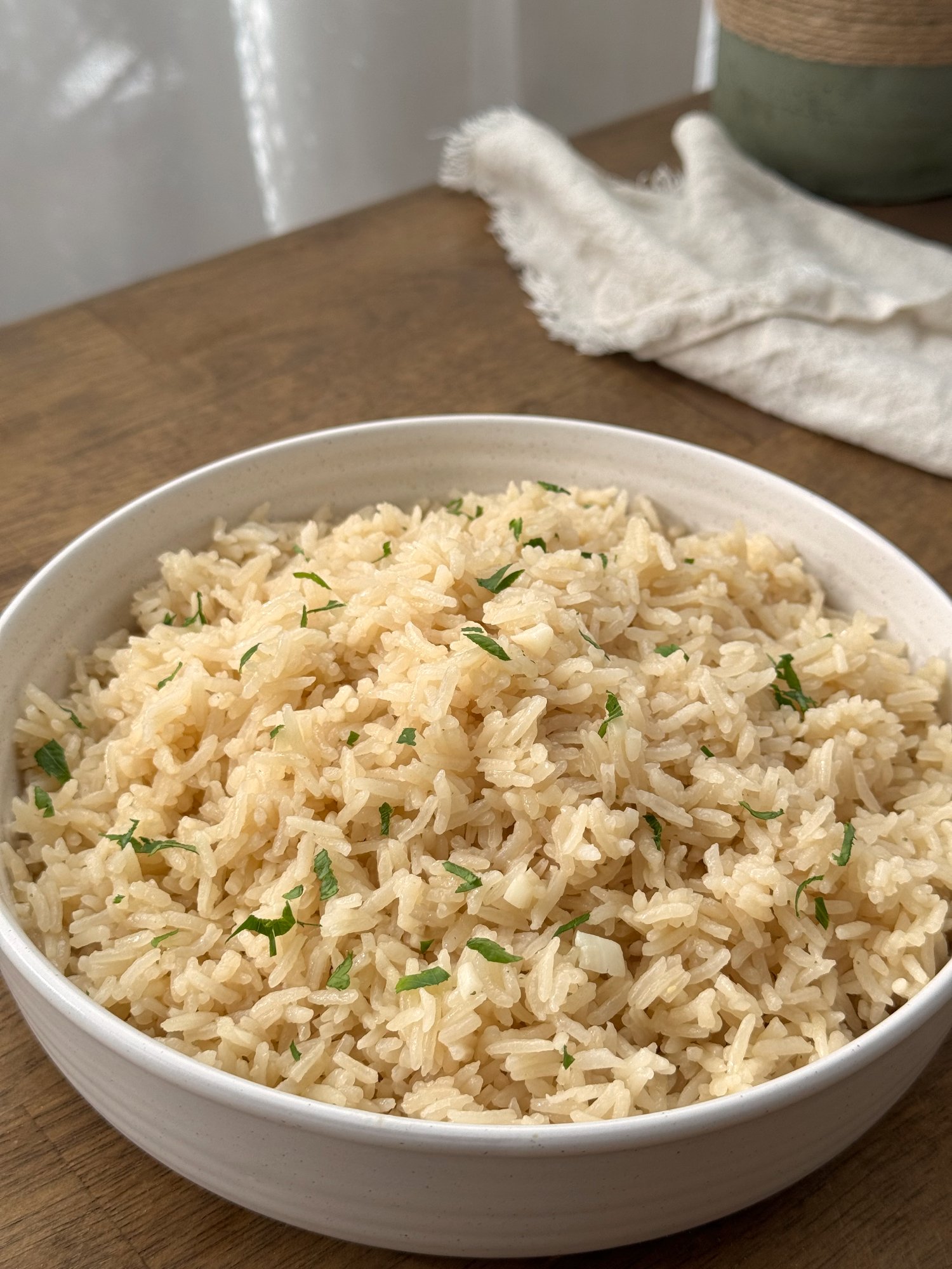 Fluffy Portuguese garlic rice (Arroz de Alho) in a white bowl.
