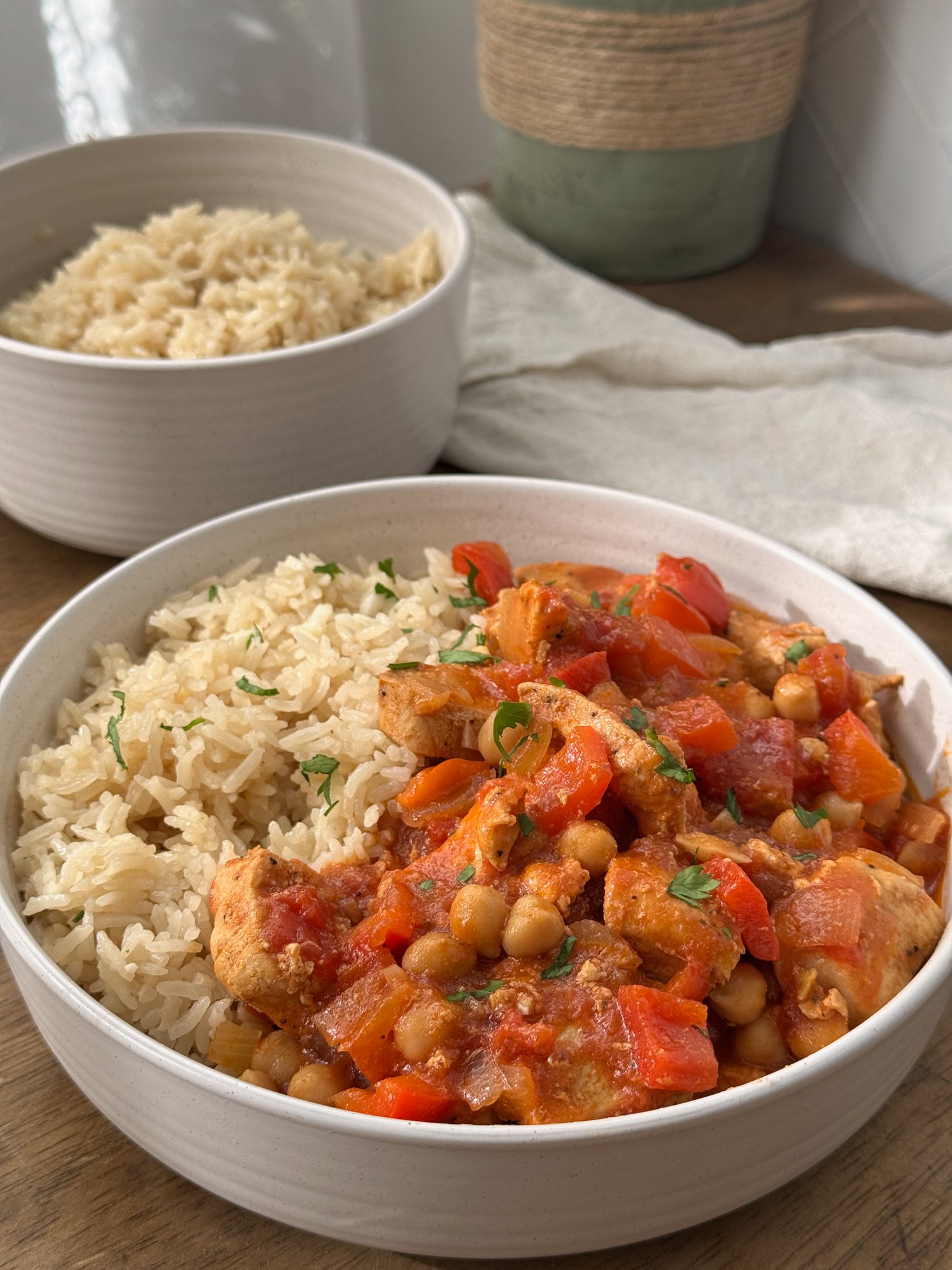 Portuguese chicken and chickpeas in a rich tomato and paprika sauce with parsley.