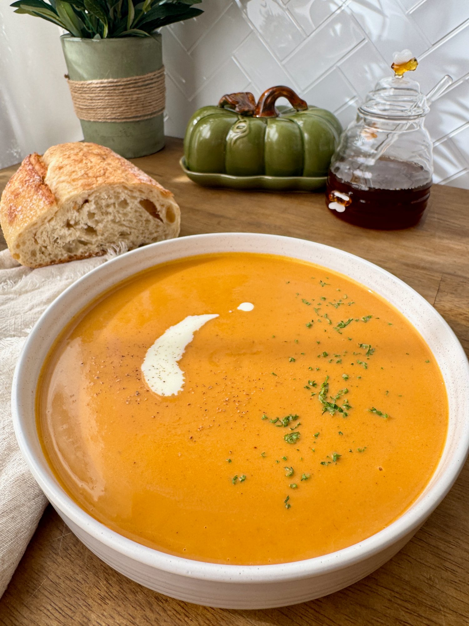 A bowl of smooth, creamy roasted butternut pumpkin soup.