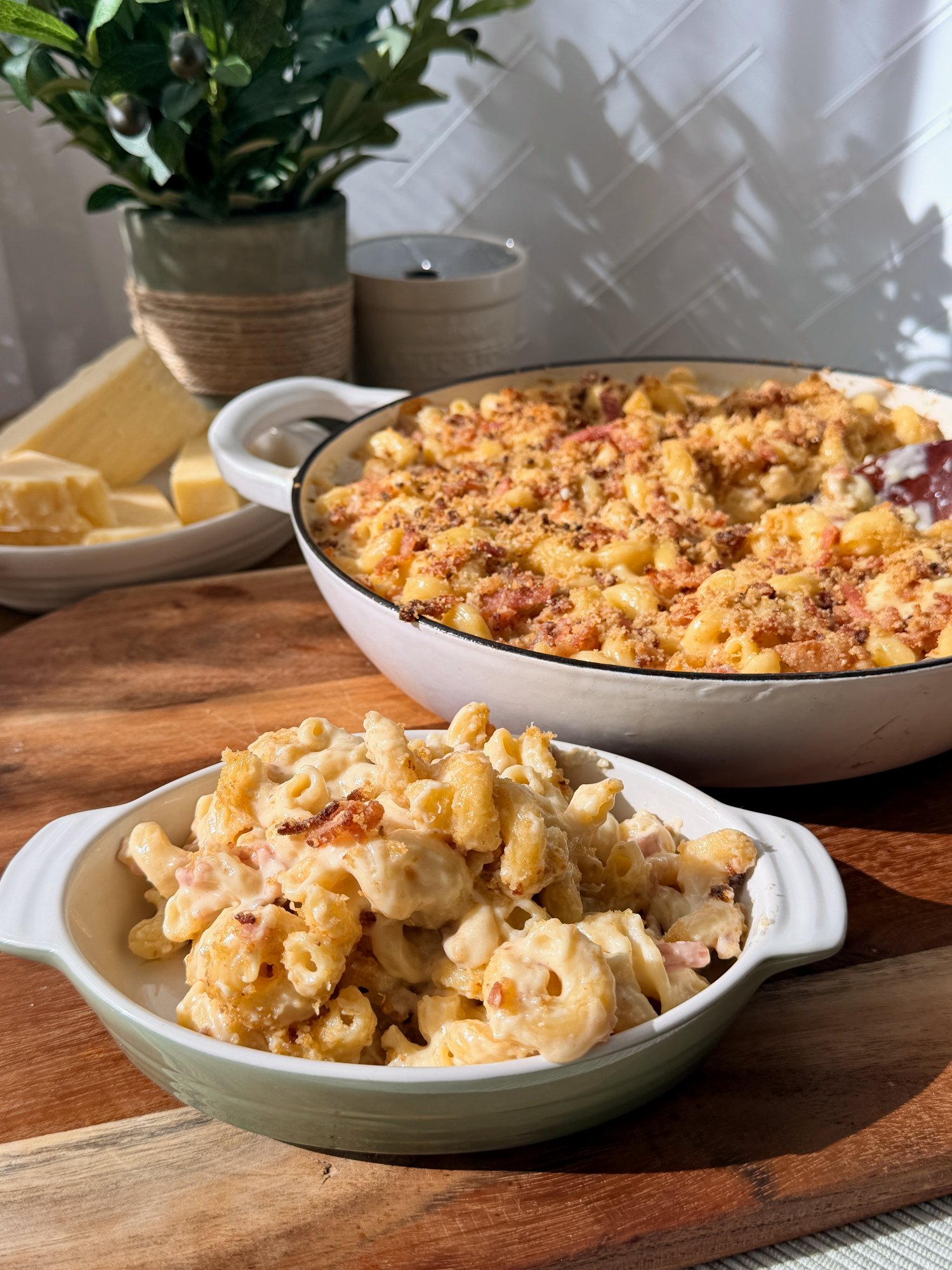 Baked macaroni cheese with a golden bacon crumb topping.