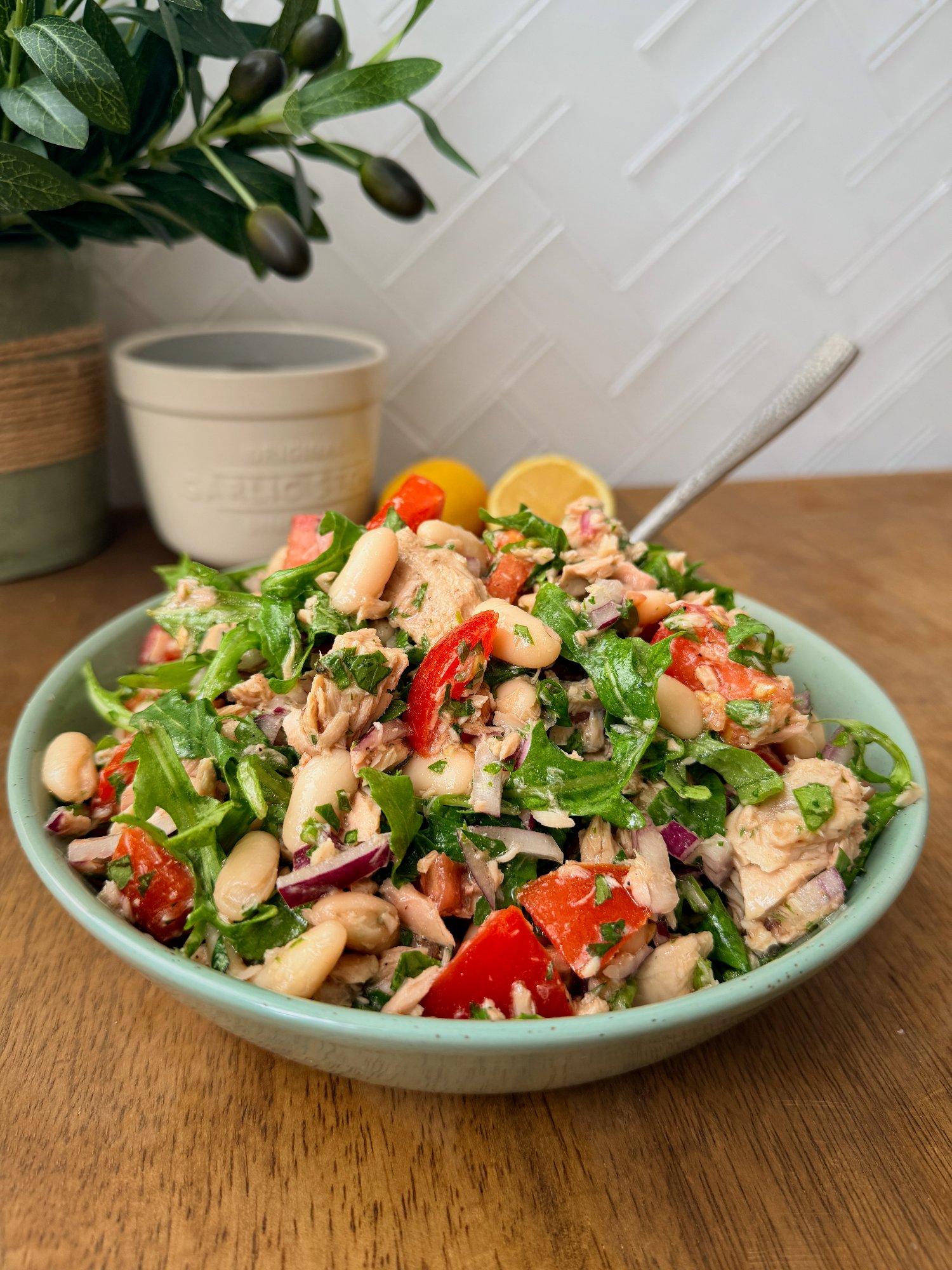 Tuna, white bean and tomato salad with red onion, parsley and baby rocket.