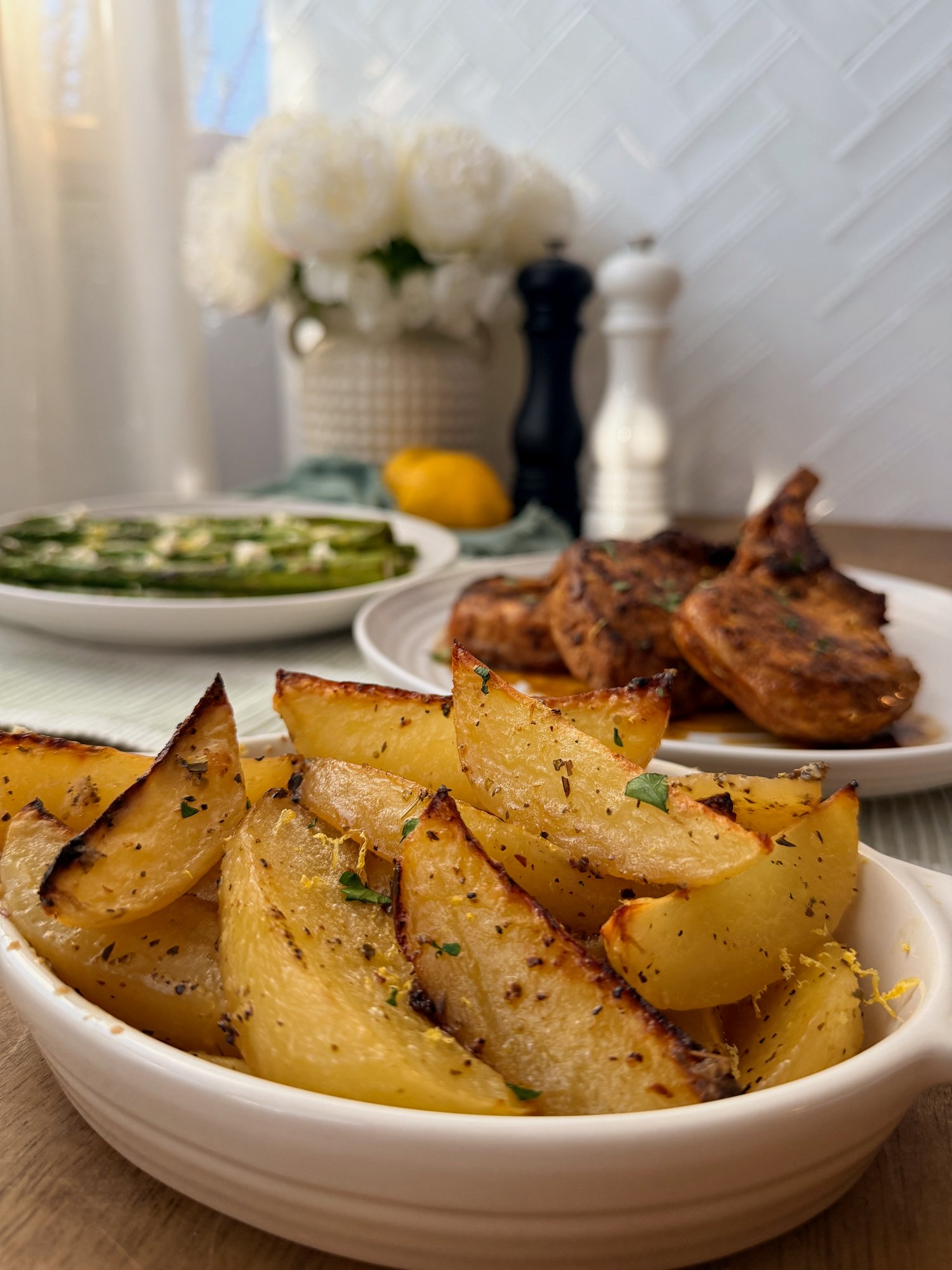 Greek-style lemon potatoes roasted until deeply golden, with garlic and oregano.