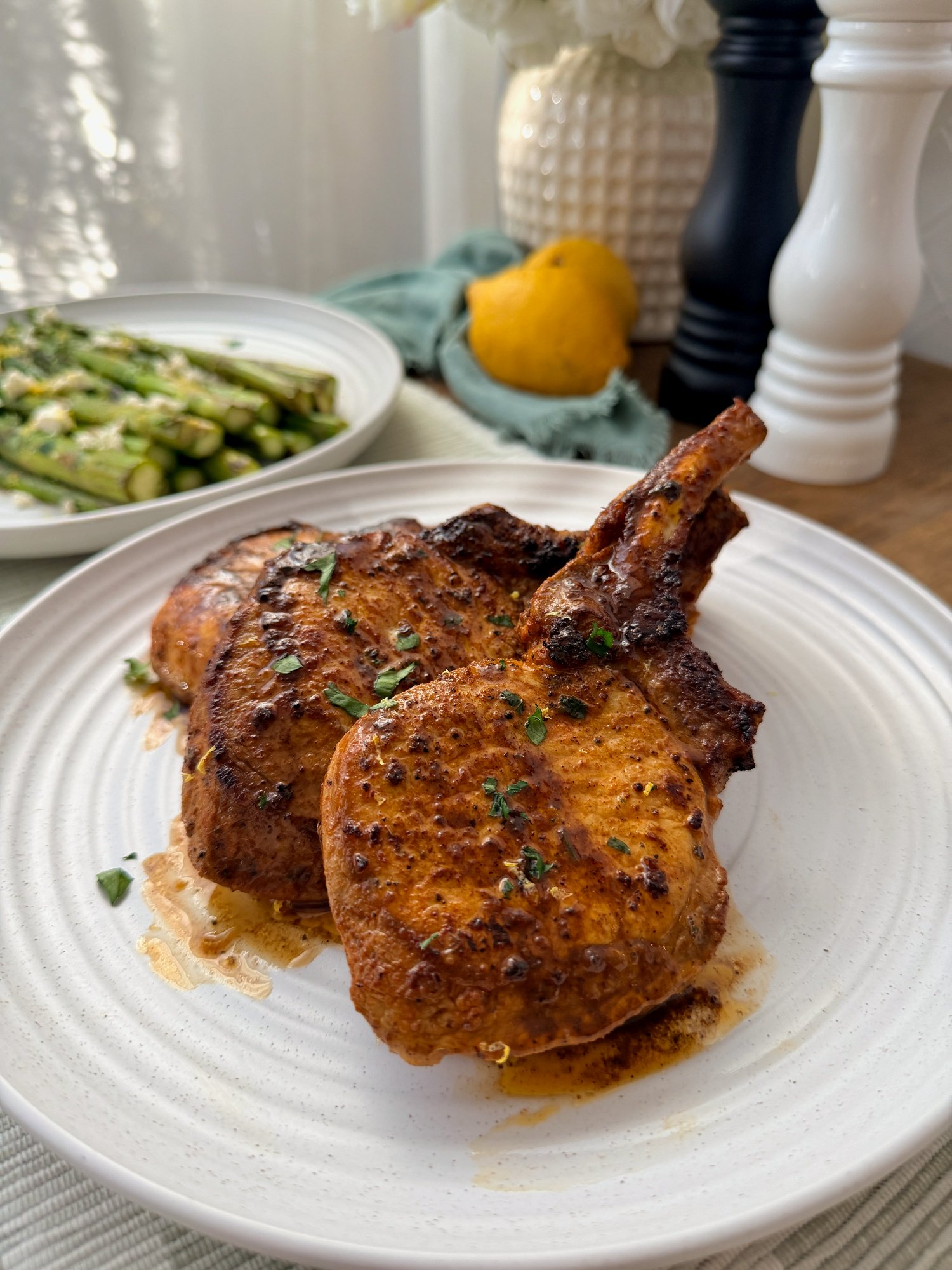 Pan-seared pork cutlets with a glossy garlic butter sauce, lemon and paprika.
