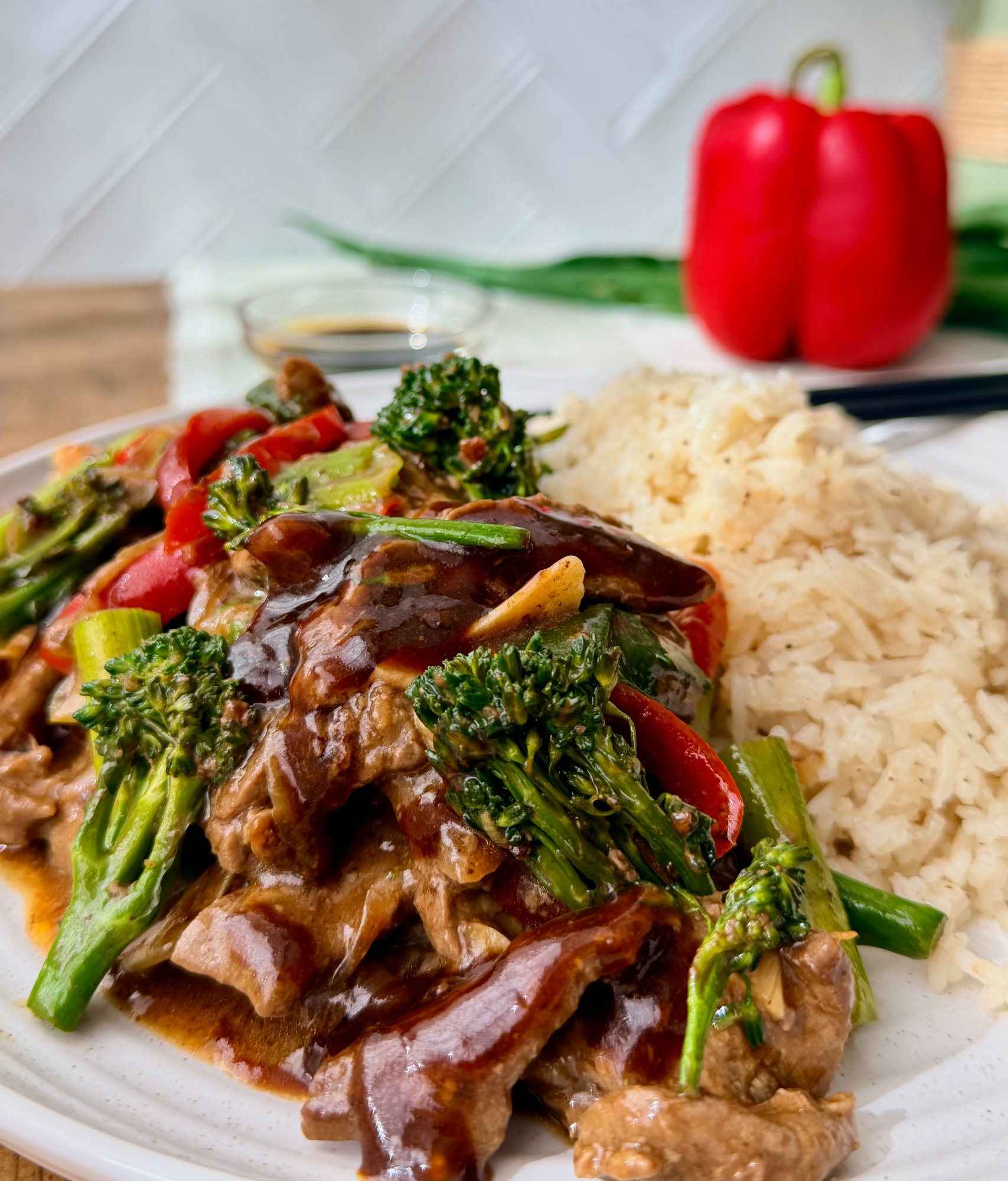 Beef, broccolini and red capsicum stir-fry in a glossy garlic oyster sauce.