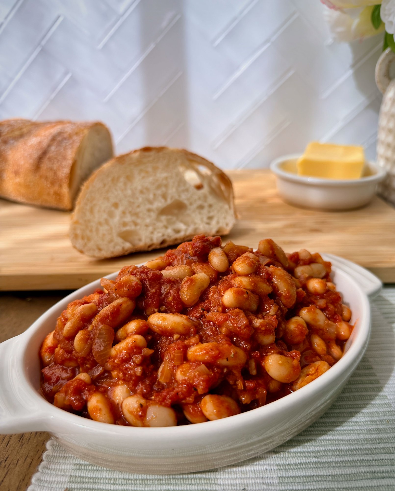 Smoky homemade baked beans with bacon in a rich tomato sauce.