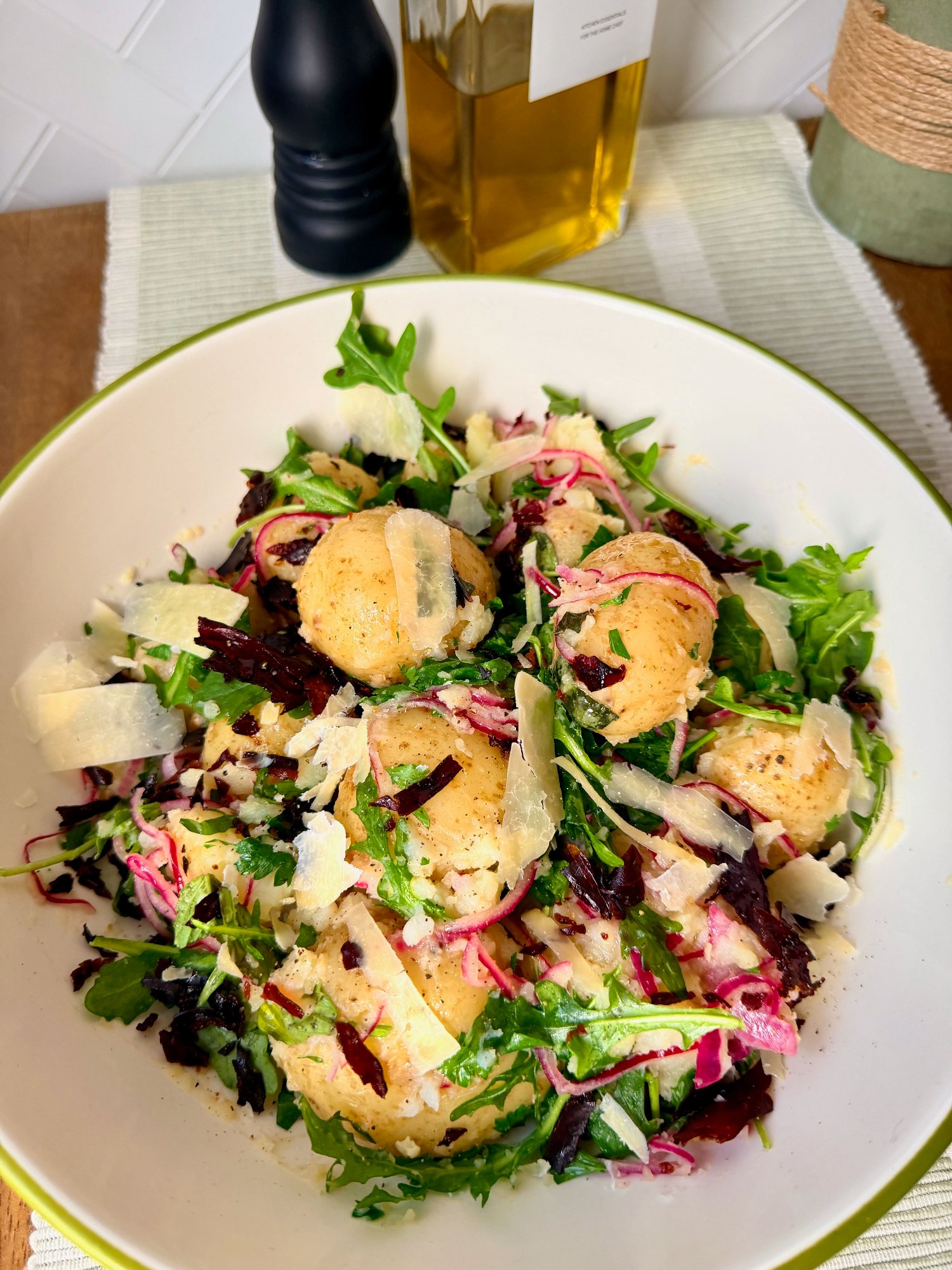 Warm Mediterranean potato salad with crispy prosciutto, rocket and shaved Parmesan.