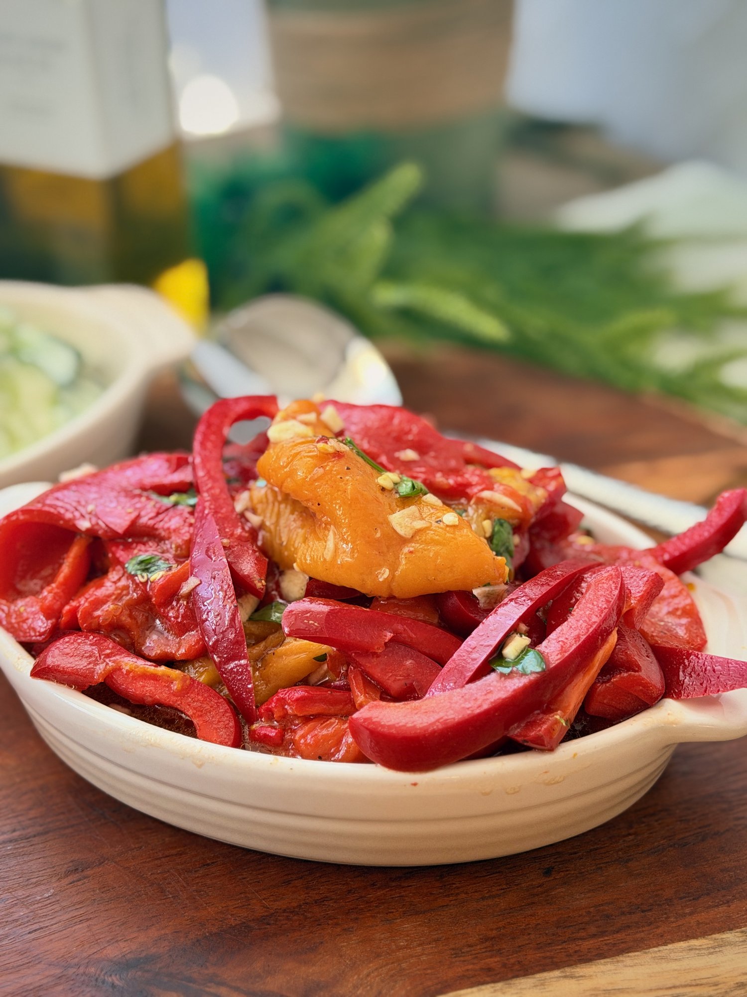 Roasted red and yellow capsicum salad with fresh red capsicum, garlic, parsley and olive oil.