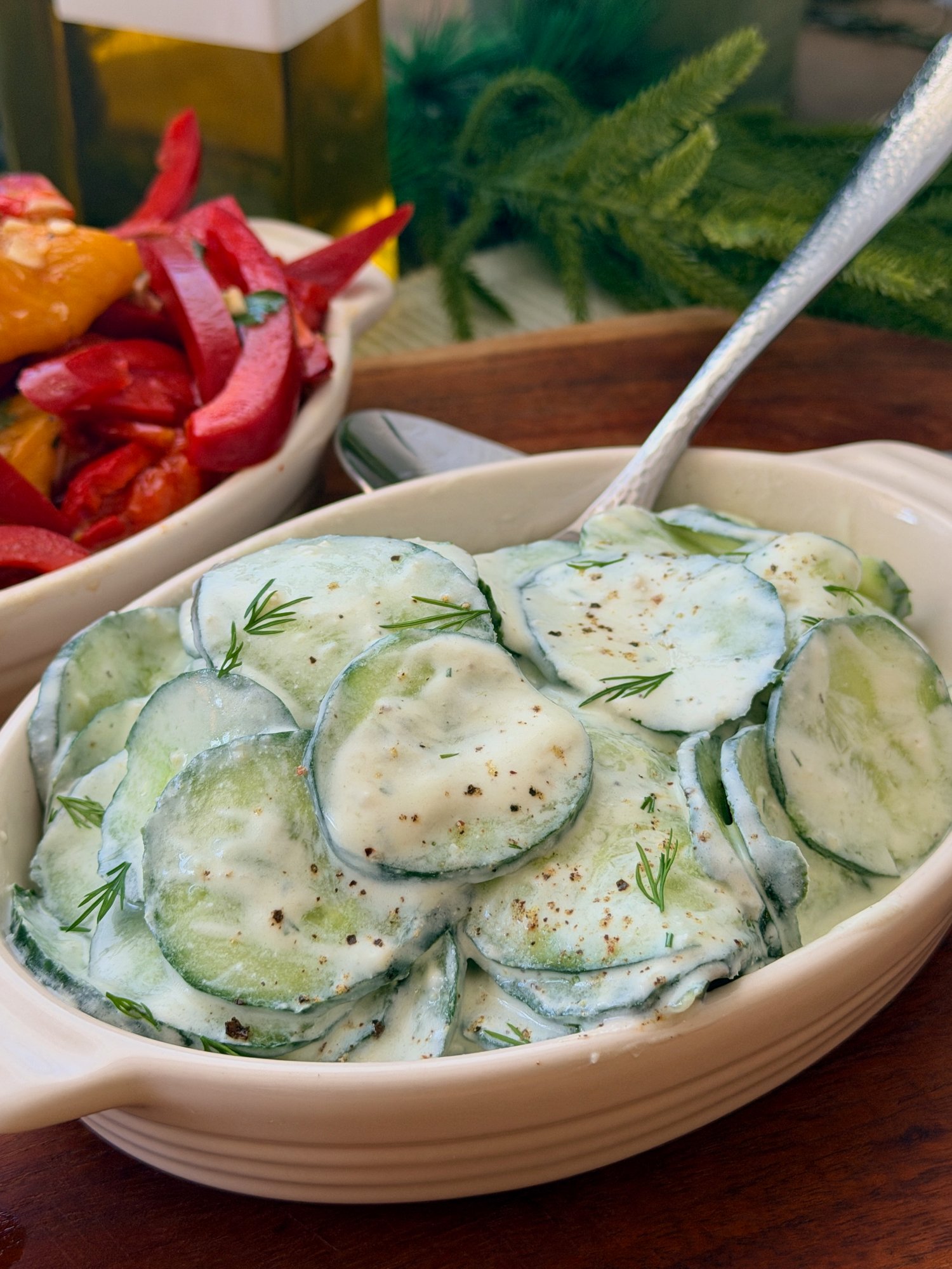 Sliced cucumber salad coated in thick Greek yoghurt with fresh dill, garlic, lemon and olive oil.