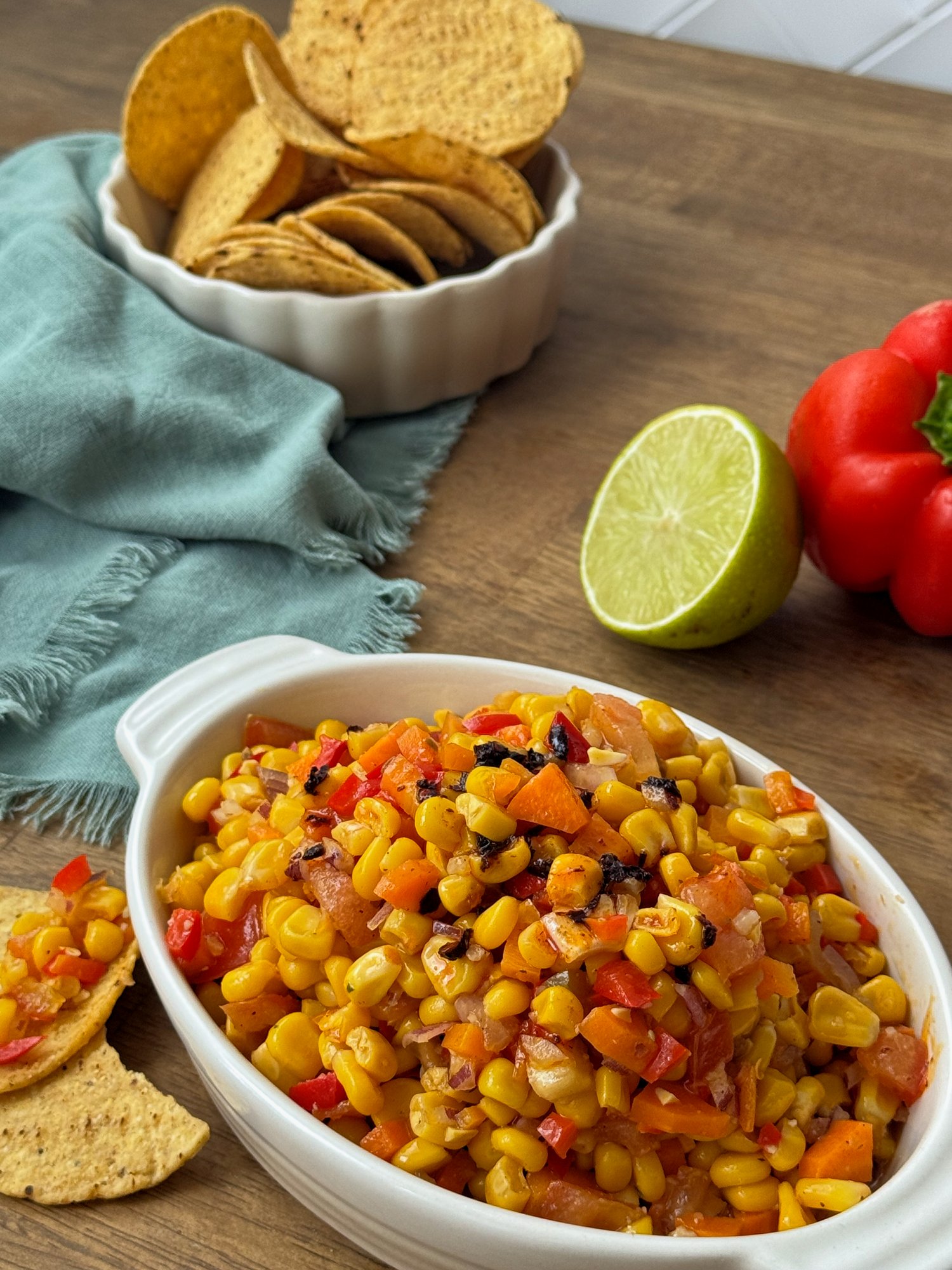 Charred corn, capsicum and carrot salad with tomato and a chilli honey dressing.