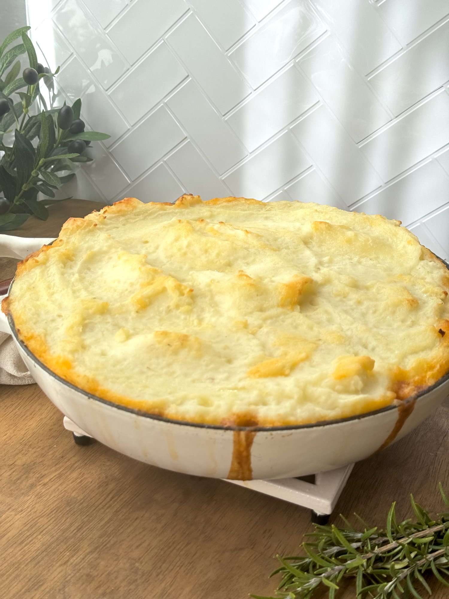 Beef mince cottage pie with a thick layer of golden baked potato mash.
