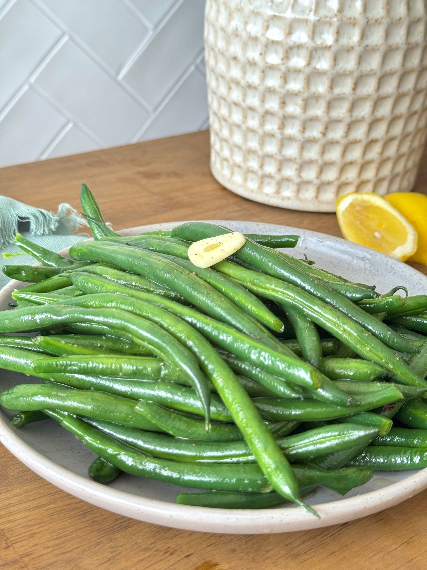 Bright green beans tossed with olive oil, sliced garlic and lemon.